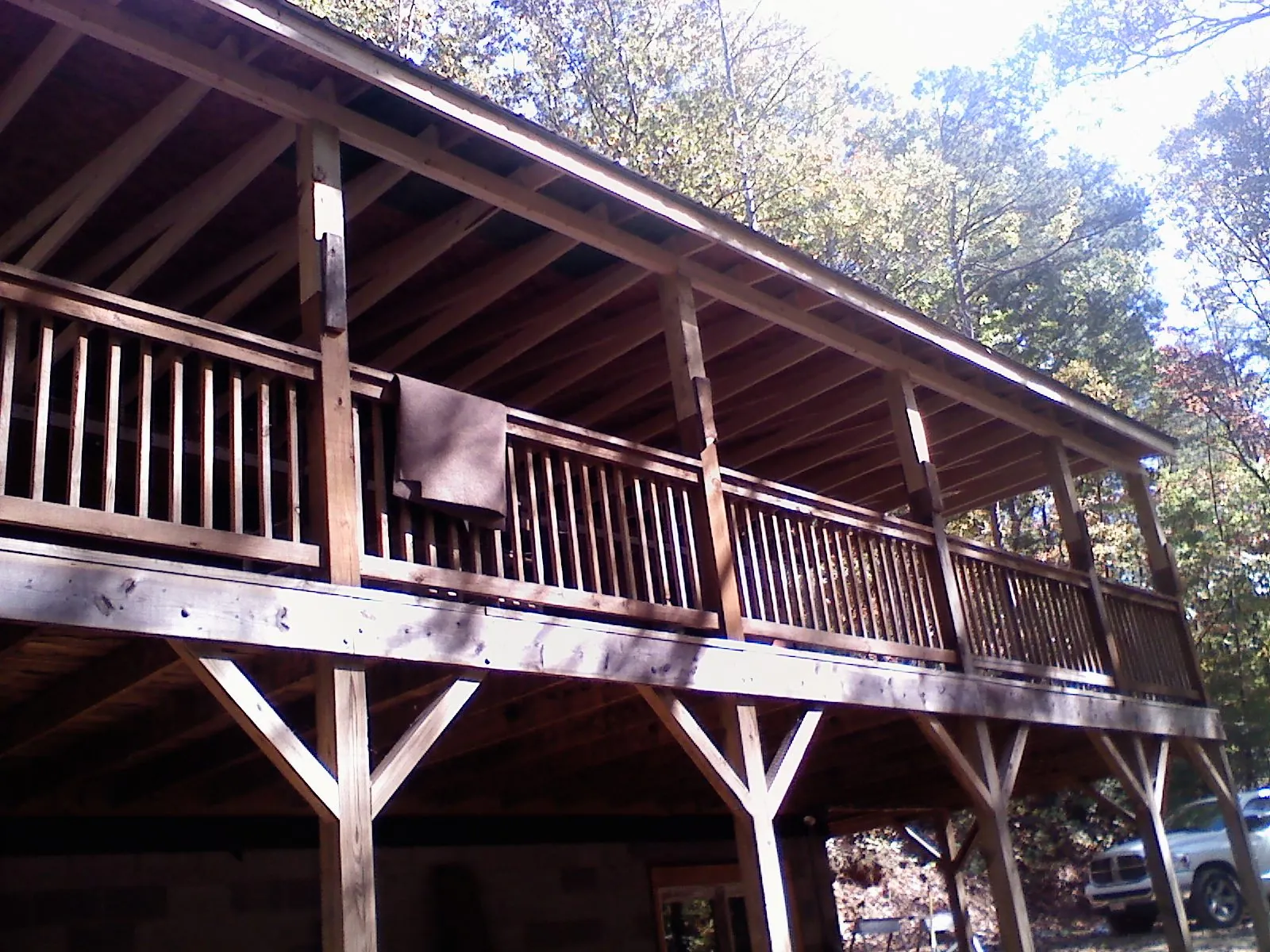 Timber framing under a new elevated porch and deck — Roof Leak Repair in Pontiac by Roofing Brothers